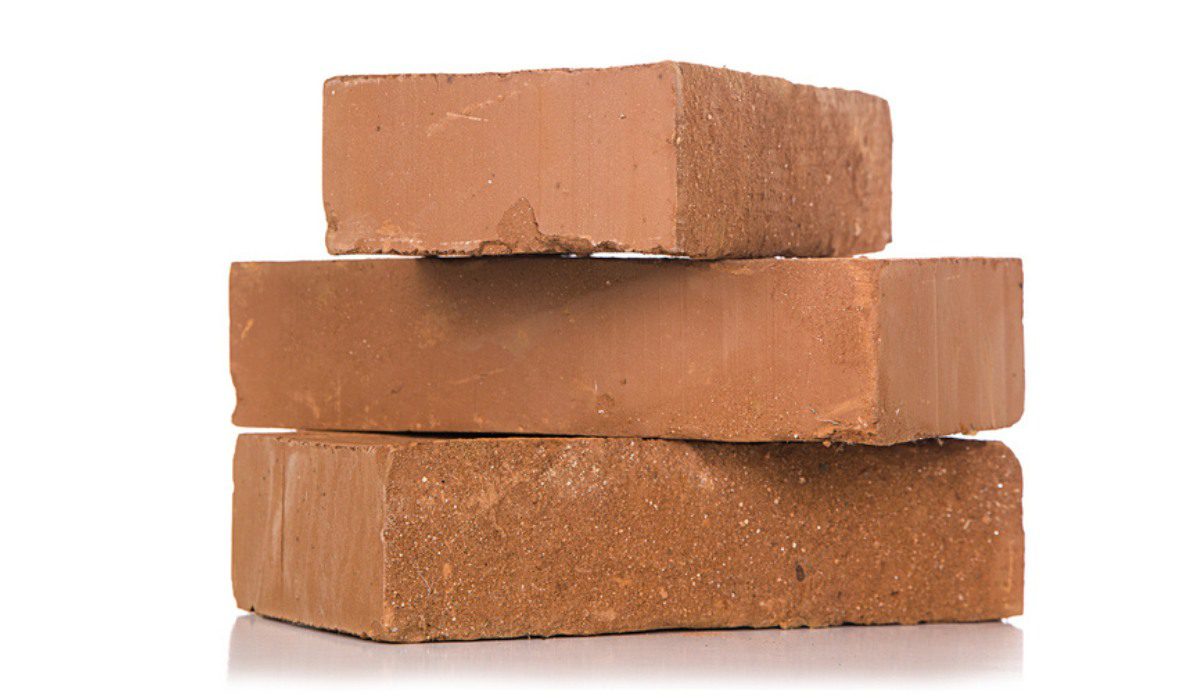 Pile of brown clay bricks for construction in Nuvem, Goa